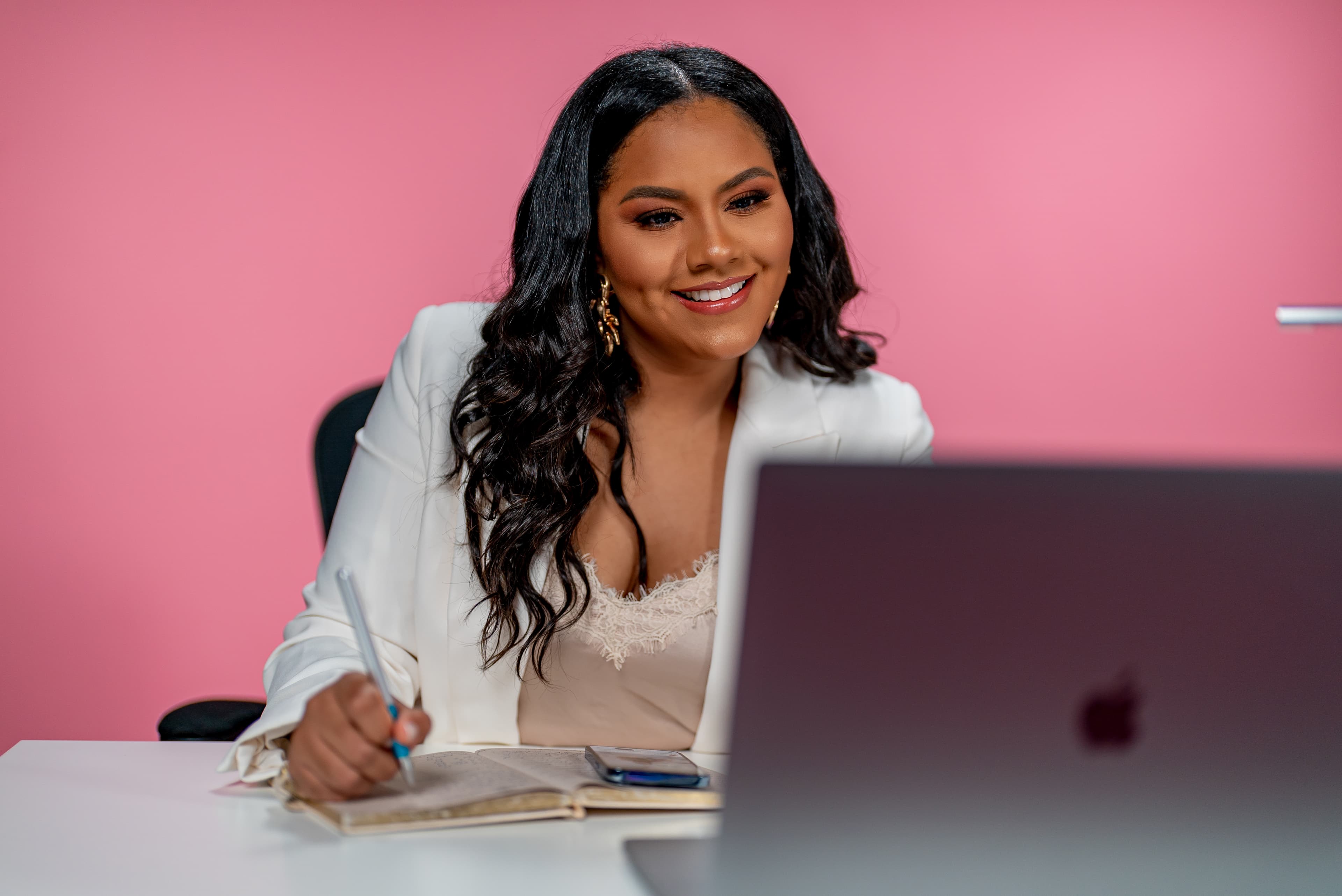 Michell Estevez Boehm working at her desk